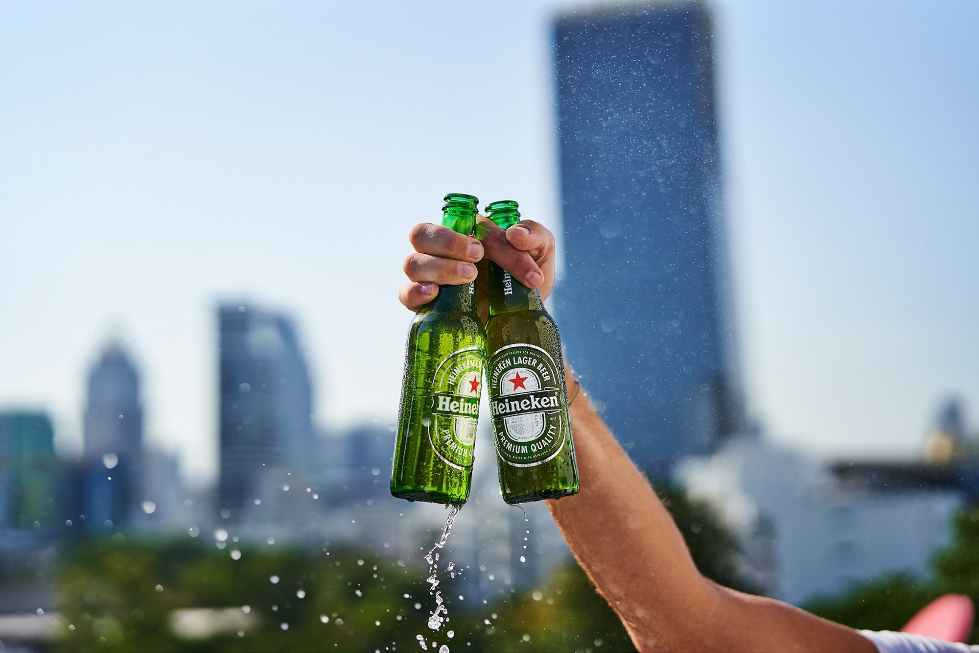 Heineken Two Beers In Hand With Skyline Visual 2000X1333